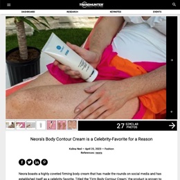Image of a woman applying Neora Firm Cream to legs in a tropical setting. 